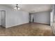 Open-concept living room with tile flooring, ample natural light, and neutral wall colors at 2233 W Oraibi Dr, Phoenix, AZ 85027