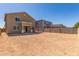 Spacious backyard featuring a stucco home and block wall, ready for landscaping and outdoor activities at 22863 N 183Rd Dr, Surprise, AZ 85387