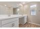 Bright bathroom featuring a double vanity, spacious mirror, and wood-look tile flooring at 22863 N 183Rd Dr, Surprise, AZ 85387