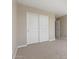 Bedroom showcasing neutral carpet and paint, closet and natural light at 22863 N 183Rd Dr, Surprise, AZ 85387