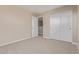 Bedroom with neutral carpet and white closet at 22863 N 183Rd Dr, Surprise, AZ 85387