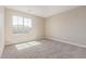 Bedroom showcasing neutral carpet and paint, window with outside view and natural light at 22863 N 183Rd Dr, Surprise, AZ 85387