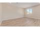 Neutral bedroom featuring a large window, wood floors, and recessed lighting at 22863 N 183Rd Dr, Surprise, AZ 85387