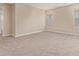 Bedroom with two windows, neutral carpet and paint with natural light at 22863 N 183Rd Dr, Surprise, AZ 85387