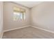 Neutral bedroom with carpet and a window at 22863 N 183Rd Dr, Surprise, AZ 85387