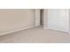 Bedroom with neutral carpet and a closet with white doors at 22863 N 183Rd Dr, Surprise, AZ 85387