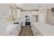 Modern kitchen with quartz countertops, stainless steel appliances, white cabinets, and tile backsplash at 22863 N 183Rd Dr, Surprise, AZ 85387