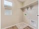 Laundry room with window and shelving at 22863 N 183Rd Dr, Surprise, AZ 85387