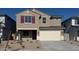 Inviting two-story home with a spacious two-car garage and low maintenance landscaping at 22863 N 183Rd Dr, Surprise, AZ 85387