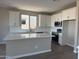 Modern kitchen featuring an island, white cabinets, stainless steel appliances, and subway tile backsplash at 22863 N 183Rd Dr, Surprise, AZ 85387