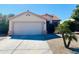 Charming single-story home with a well-maintained front yard and two car garage, perfect for suburban living at 244 N Rock St, Gilbert, AZ 85234