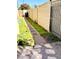 Landscaped backyard with stone pathway and block wall fencing at 244 N Rock St, Gilbert, AZ 85234