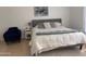 Comfortable bedroom featuring a queen size bed, a cozy chair, and soft lighting at 244 N Rock St, Gilbert, AZ 85234