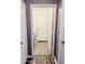 Hallway view showing laundry room and tiled flooring at 244 N Rock St, Gilbert, AZ 85234