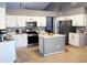 Bright kitchen featuring stainless steel appliances, white cabinets, and center island at 244 N Rock St, Gilbert, AZ 85234