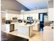 Modern kitchen with white cabinets, stainless steel appliances, and center island at 244 N Rock St, Gilbert, AZ 85234