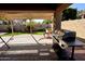 Covered patio with a barbecue grill and view of the backyard at 244 N Rock St, Gilbert, AZ 85234