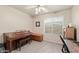 Versatile room with a window, piano, and wooden storage chest at 244 N Rock St, Gilbert, AZ 85234
