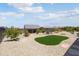 Well-maintained backyard with desert landscaping, providing a serene outdoor space at 26824 W Ponderosa Ln, Buckeye, AZ 85396