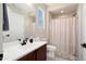 Bright bathroom with large mirror, vanity, toilet, and shower/tub combination at 26824 W Ponderosa Ln, Buckeye, AZ 85396