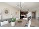 A sunlit dining room adjacent to the kitchen, with sleek modern furnishings and stylish decor at 26824 W Ponderosa Ln, Buckeye, AZ 85396