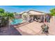 Private backyard featuring a refreshing pool, covered patio, and low-maintenance landscaping perfect for outdoor living at 2721 N 107Th Dr, Avondale, AZ 85392