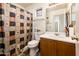 The bathroom features a toilet, shower with curtain, vanity with sink, and overhead lights at 2721 N 107Th Dr, Avondale, AZ 85392
