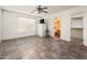 An empty bedroom offers lots of space and features a private ensuite bathroom and large walk-in closet at 2721 N 107Th Dr, Avondale, AZ 85392