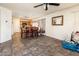 Dining area adjacent to kitchen, featuring tile floors and ample space at 2721 N 107Th Dr, Avondale, AZ 85392