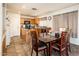 Functional kitchen with wood cabinets and adjacent dining area at 2721 N 107Th Dr, Avondale, AZ 85392