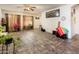 Open-concept living room featuring tile flooring, lots of space, and natural lighting at 2721 N 107Th Dr, Avondale, AZ 85392