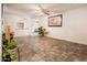 Bright living room with tile floors, offering a clean and neutral space for relaxation at 2721 N 107Th Dr, Avondale, AZ 85392
