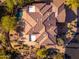 Aerial view of a Southwestern home featuring a tile roof, an expansive patio, and a private pool at 28768 N 95Th Way, Scottsdale, AZ 85262