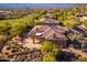 Aerial view showcasing desert home with patio and pool plus lush landscaping for ultimate outdoor living at 28768 N 95Th Way, Scottsdale, AZ 85262