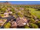 Expansive home with tile roof nestled in lush desert landscaping and near a beautiful golf course at 28768 N 95Th Way, Scottsdale, AZ 85262