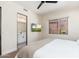 Cozy bedroom featuring a wall-mounted TV, recessed lighting and a window view of the exterior courtyard at 28768 N 95Th Way, Scottsdale, AZ 85262