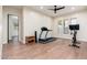 Spacious bonus room with a treadmill and exercise bike, offering a versatile space for fitness activities at 28768 N 95Th Way, Scottsdale, AZ 85262