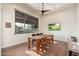 Bright dining room features light colored hardwood floors, large window and views of the desert landscape at 28768 N 95Th Way, Scottsdale, AZ 85262