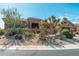 Charming desert-landscaped home with natural rock features and mature landscaping at 28768 N 95Th Way, Scottsdale, AZ 85262