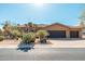 Beautiful desert-landscaped home with a three car garage and attractive front entryway at 28768 N 95Th Way, Scottsdale, AZ 85262
