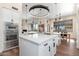 A modern kitchen with a large island, stainless steel appliances and pendant lighting at 28768 N 95Th Way, Scottsdale, AZ 85262