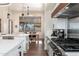 Gourmet kitchen featuring modern appliances, quartz countertops and a cozy breakfast nook at 28768 N 95Th Way, Scottsdale, AZ 85262