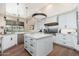 A modern kitchen with white cabinets, stainless steel appliances and large center island at 28768 N 95Th Way, Scottsdale, AZ 85262