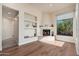 The living room features hardwood floors, fireplace, picture window and modern décor at 28768 N 95Th Way, Scottsdale, AZ 85262