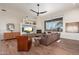 Comfortable living room with fireplace, entertainment center and view to the outdoors at 28768 N 95Th Way, Scottsdale, AZ 85262