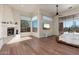 The main bedroom has hardwood floors, a sliding glass door to the patio and fireplace at 28768 N 95Th Way, Scottsdale, AZ 85262