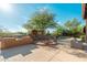 The beautiful outdoor living area features a grill, fireplace, and desert landscaping at 28768 N 95Th Way, Scottsdale, AZ 85262