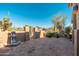 A private outdoor patio with a tile floor, water feature, and mature landscaping at 28768 N 95Th Way, Scottsdale, AZ 85262