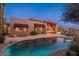Inviting backyard pool with a covered patio and comfortable seating area for outdoor entertaining at 28768 N 95Th Way, Scottsdale, AZ 85262