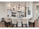 Bright and open kitchen with a large island, stainless steel appliances, and stylish pendant lighting at 28768 N 95Th Way, Scottsdale, AZ 85262